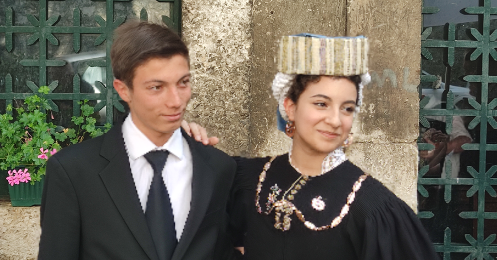 A young bridal couple posing outside the chapel prior to Ju Catenacce